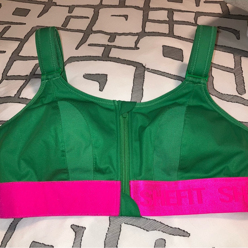 Kelly green and hot pink SheFit Ultimate Sports Bra